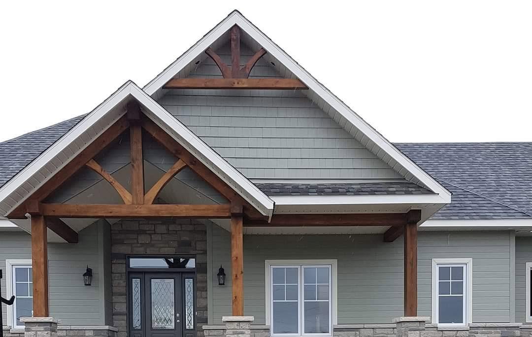 Craftsman-style gable roof with timber accents and asphalt shingles
