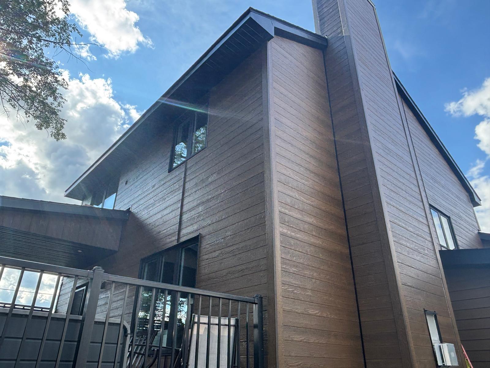 Close-up of St-Laurent wood composite siding texture on Orleans Ottawa home
